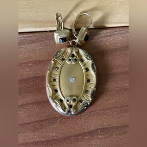 Antique CQR Locket in an oval shape 1.75x1.25”.
